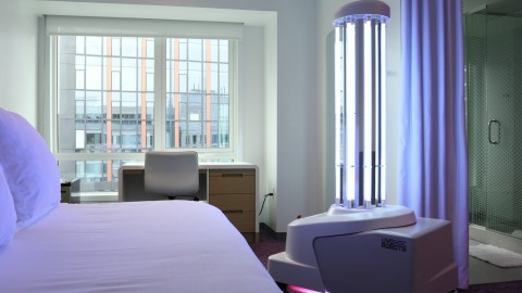 “Right now it’s critical for the hospitality industry to not only enhance how we protect travelers but also provide them with reassurance that we’re taking every possible step from check-in to check-out,” said Trish Berry, General Manager, YOTEL Boston. An extension of YOTEL’s operation #SmartStay safety measures, the UVD Robot, named ‘Vi-YO-Let’, will offer an even deeper level of disinfection throughout high-touch public spaces and select cabins at YOTEL Boston. Photo credit: YOTEL Boston.